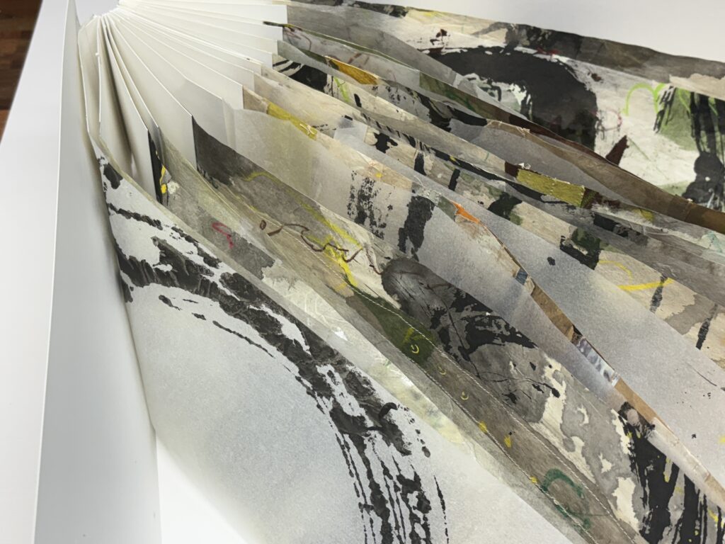 Artists book with graffiti like marks on pages