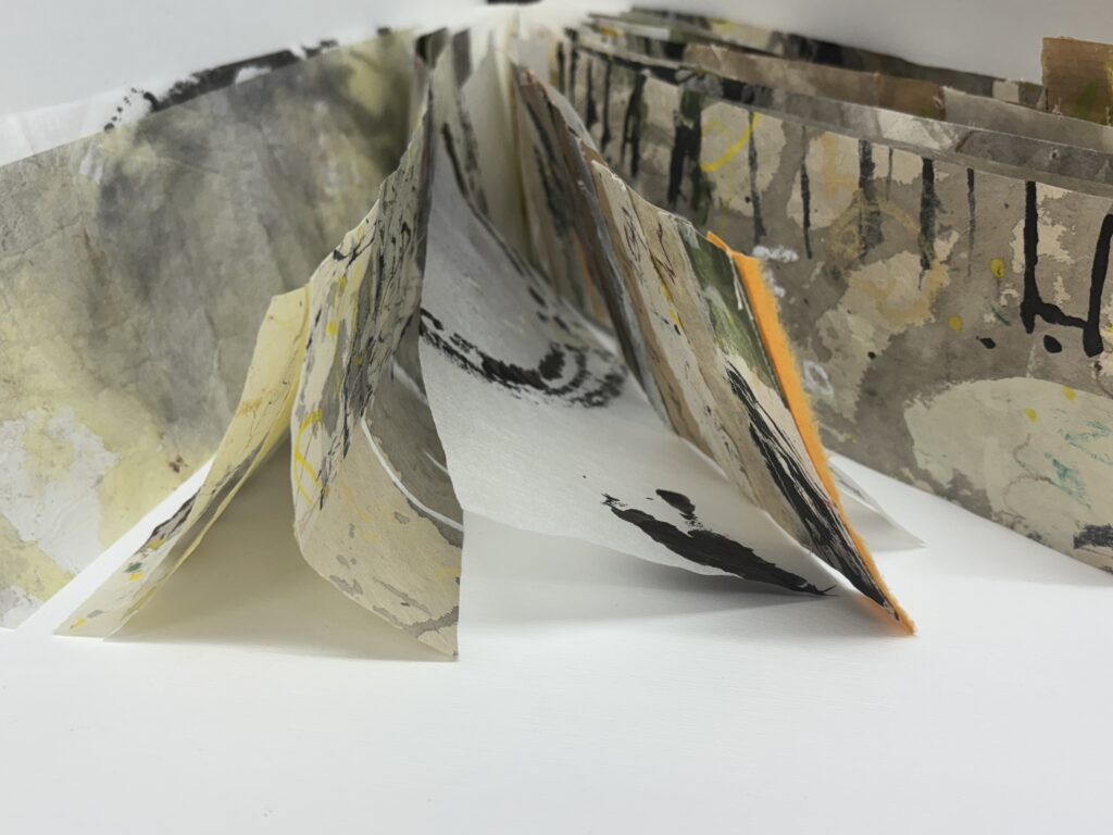 Artists book with graffiti like marks on pages