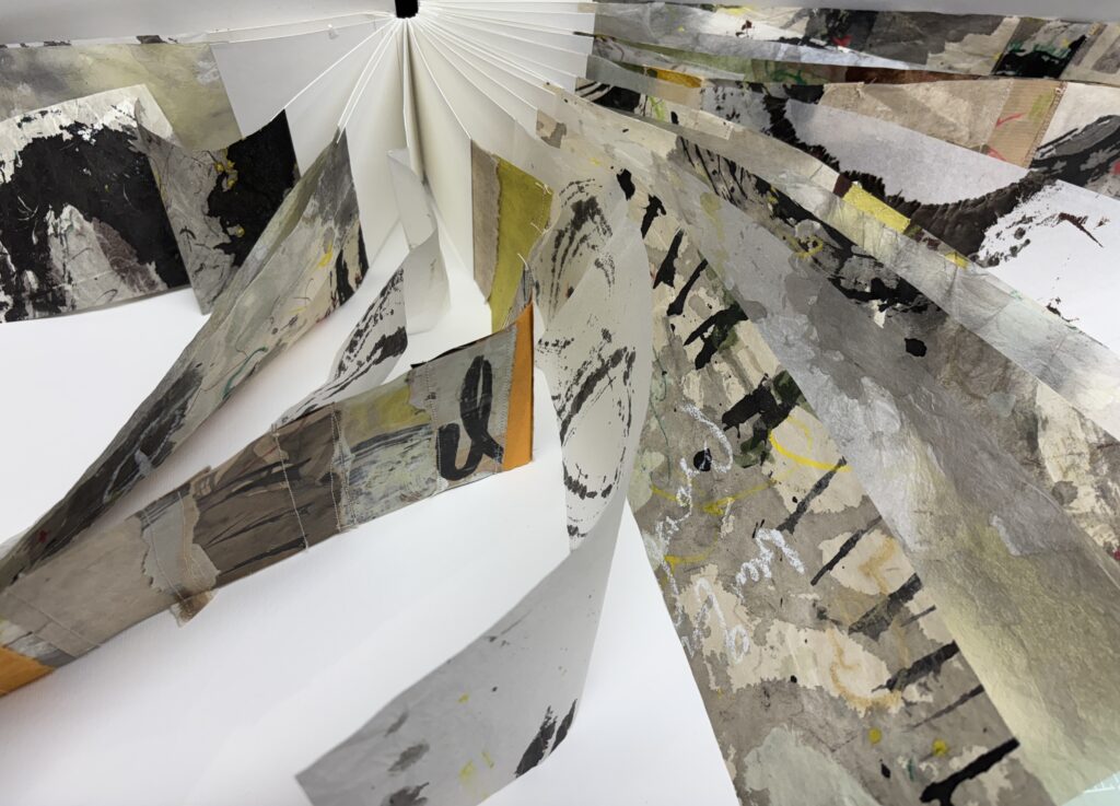 Artists book with graffiti like marks on pages