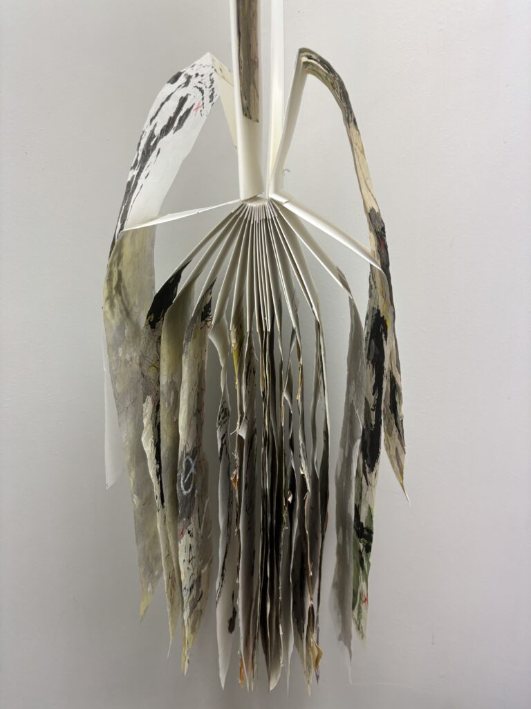 Artists book with graffiti like marks on pages