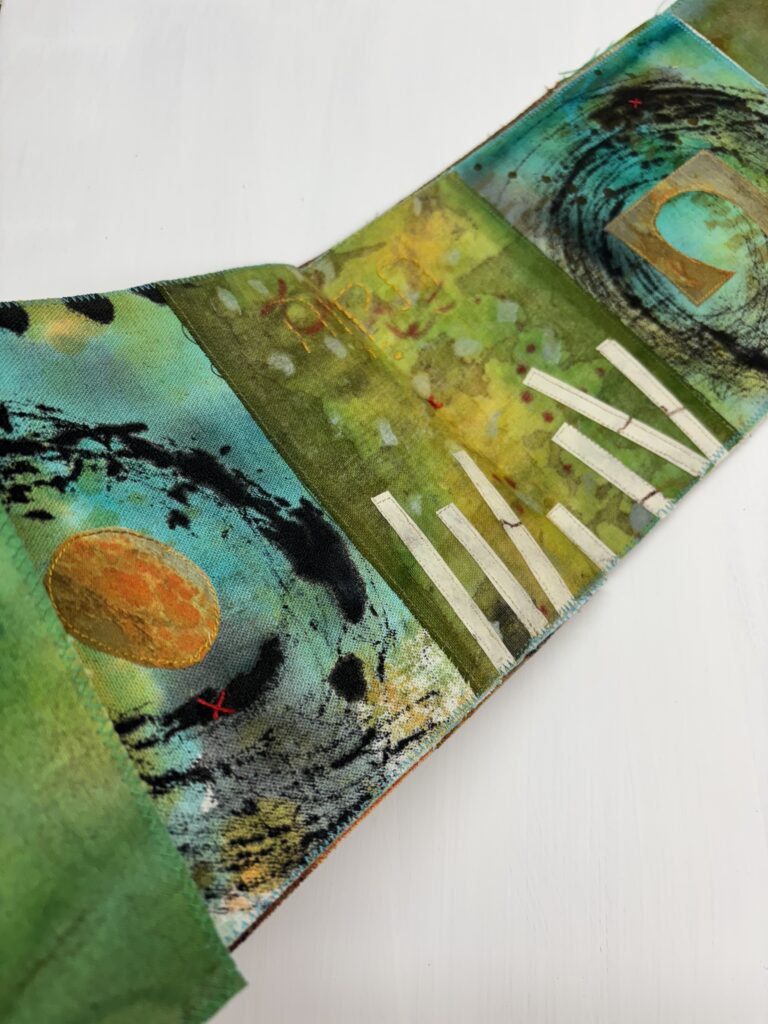 Fabric artist book with green collages pages and Jewish theme