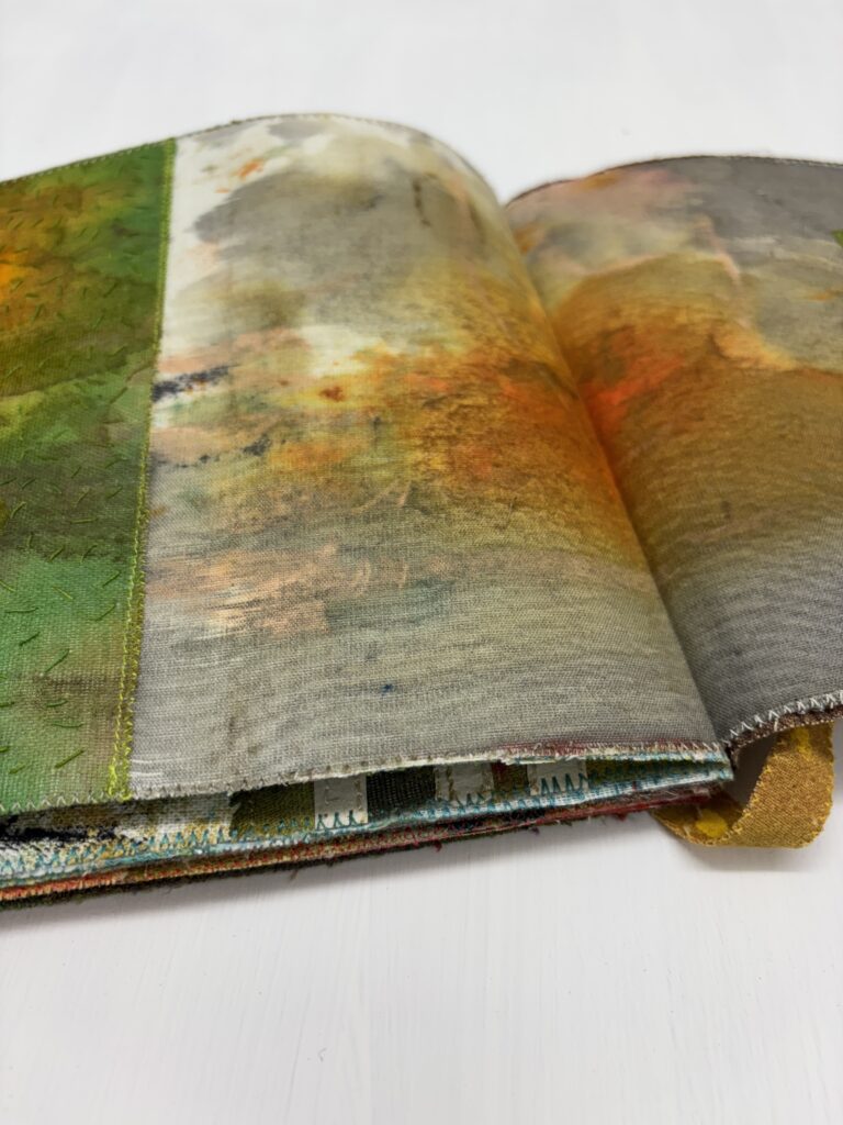 Fabric artist book with green collaged pages and Jewish theme