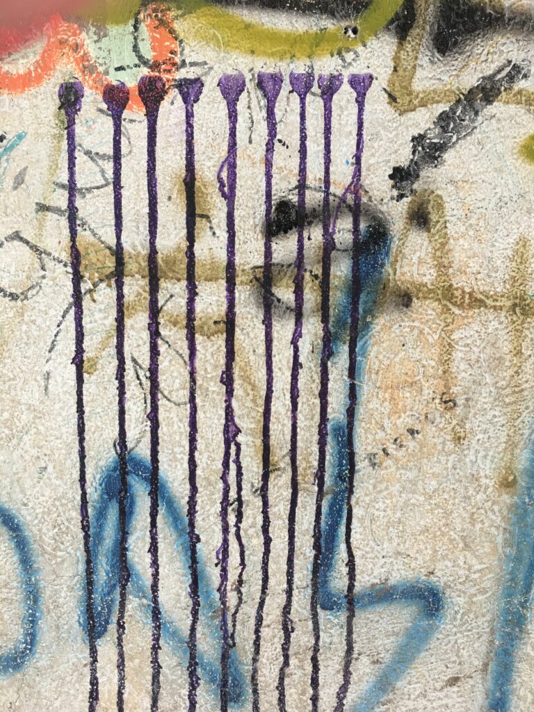 Graffiti showing a pattern reminiscent of a Menorah